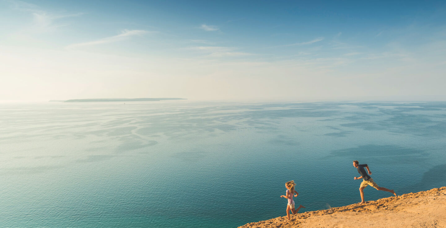 Visitors to Sleeping Bear Dunes National Lakeshore near Traverse City, Michigan; Credit: Traverse City Tourism