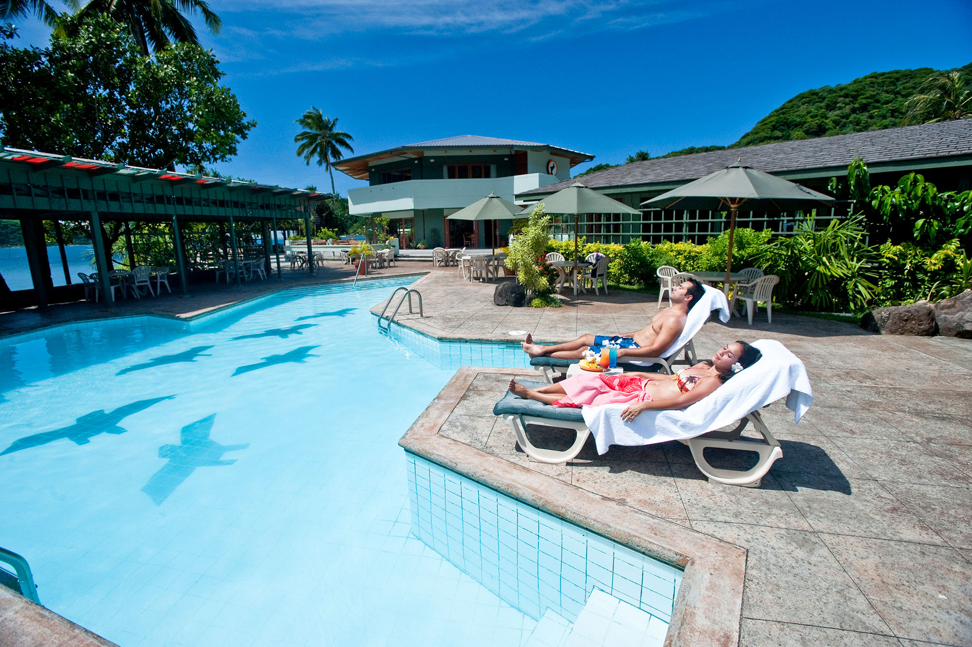 Visitors poolside at Saide’s by the Sea Hotel in Pago Pago, American Samoa