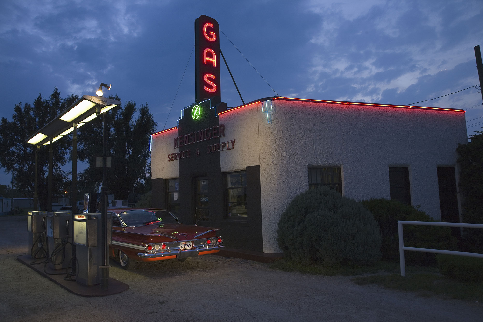Vintage car parked at a historic gas station off Lincoln Highway near Grand Island, Nebraska