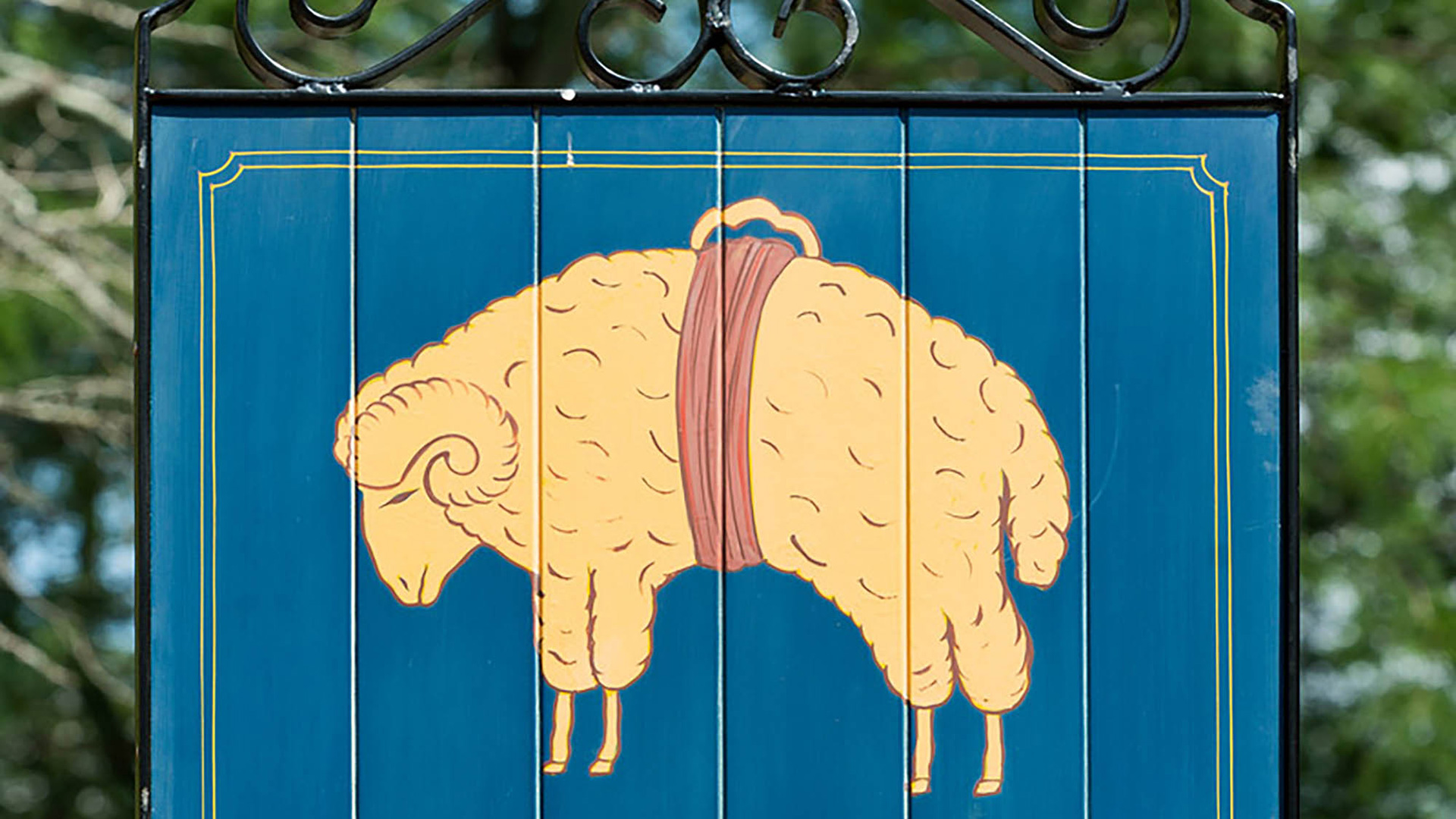 A painted sign advertises The Golden Fleece Tavern in Dover, Delaware