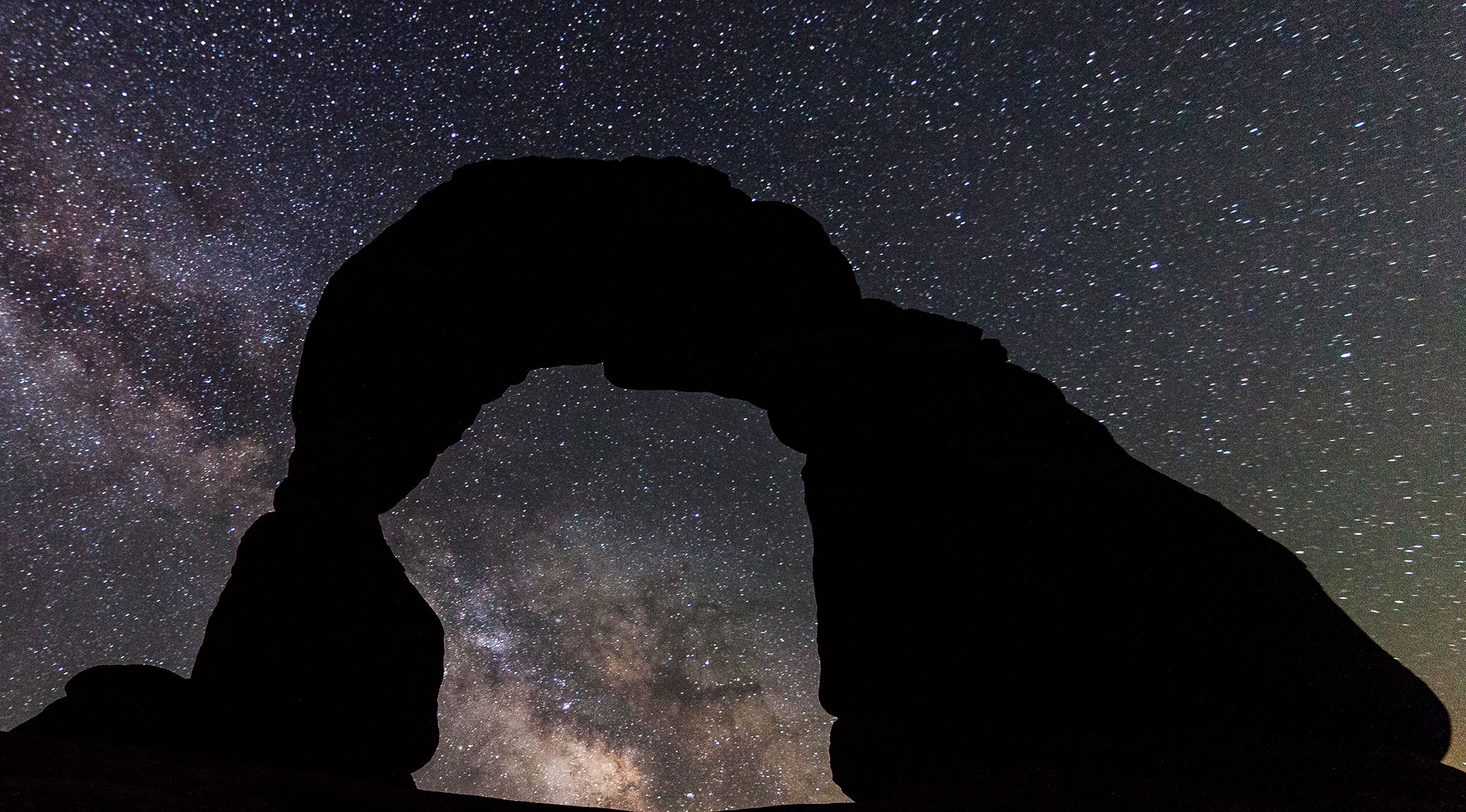 Delicate Arch on a starry night at Arches National Park in Utah