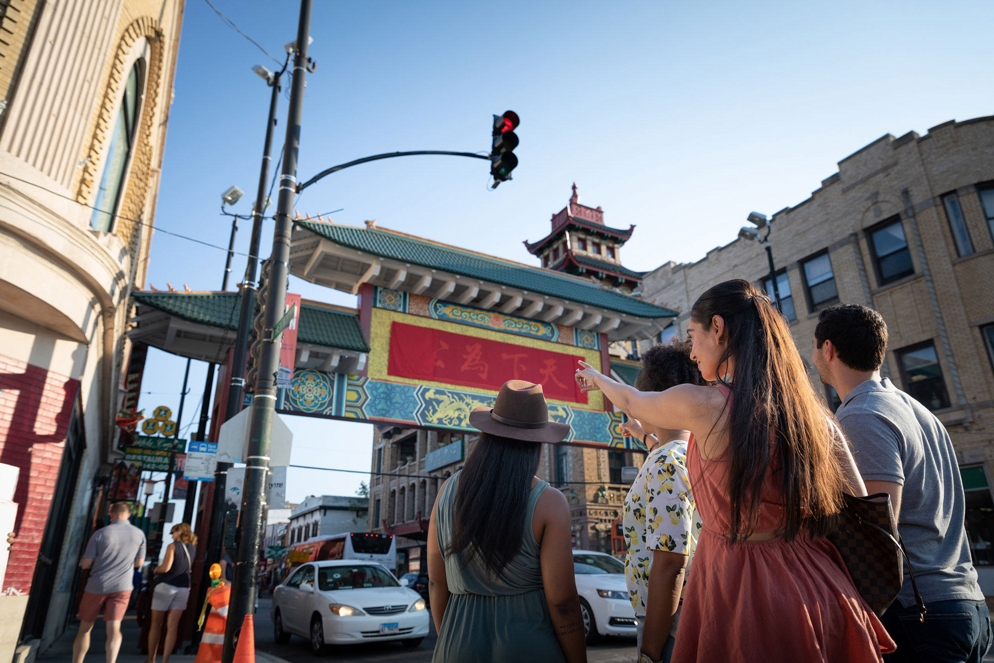 Visitors admiring the Chinatown Gate in the Chinatown Neighborhood of Chicago, Illinois.
