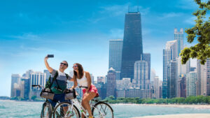 Visitors taking a selfie while on a bike ride along Lake Michigan in Chicago, Illinois.