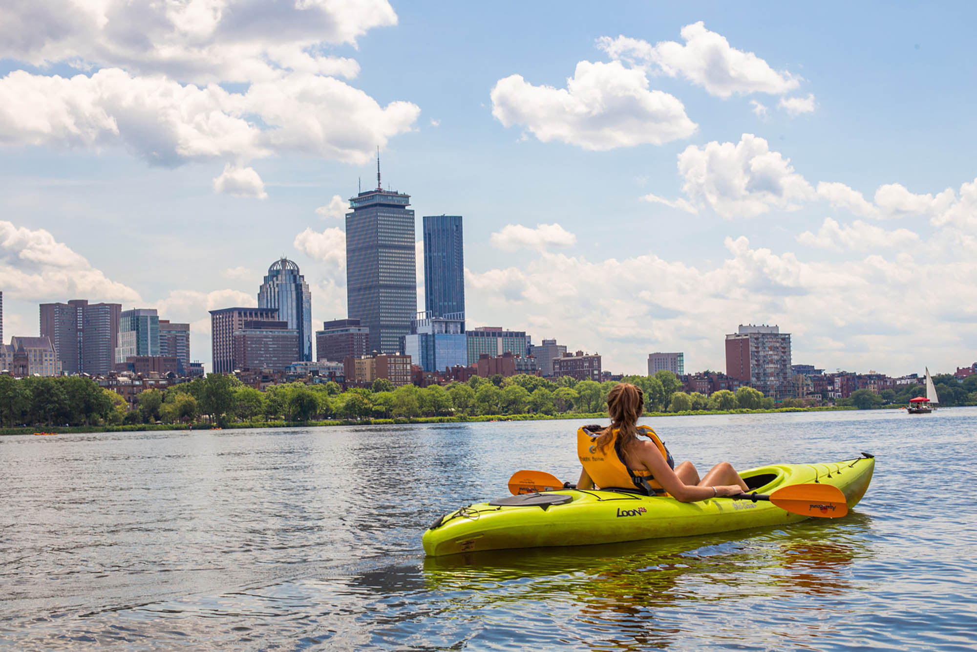 A woman kayaking in the Charles River in Boston, Massachusetts; Credit: Jessica E Scott