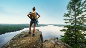 Hiker on Honeymoon Bluff in Grand Marais, Minnesota; Credit: Explore Minnesota