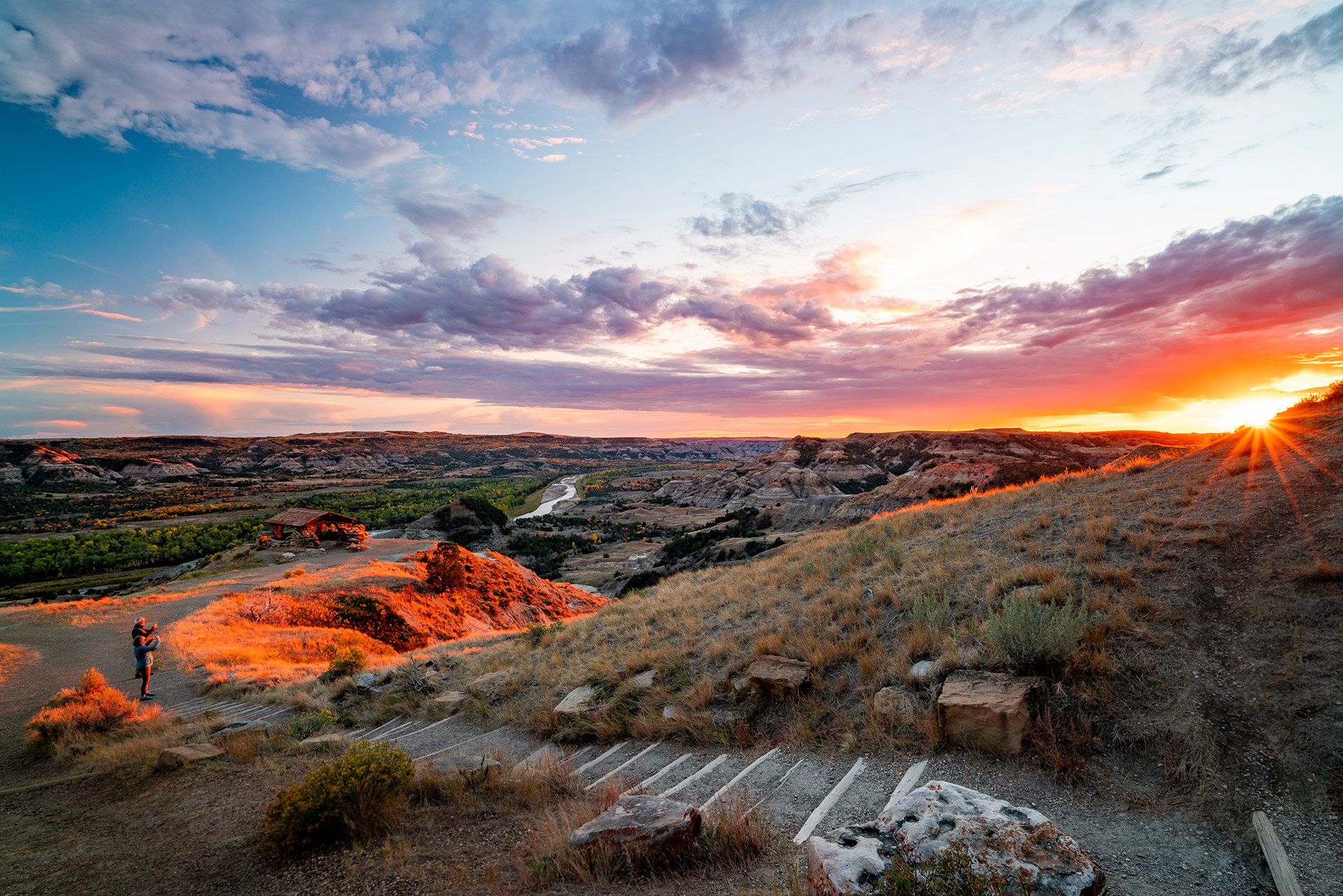 Hikers photographing views at Theodore Roosevelt National Park in North Dakota