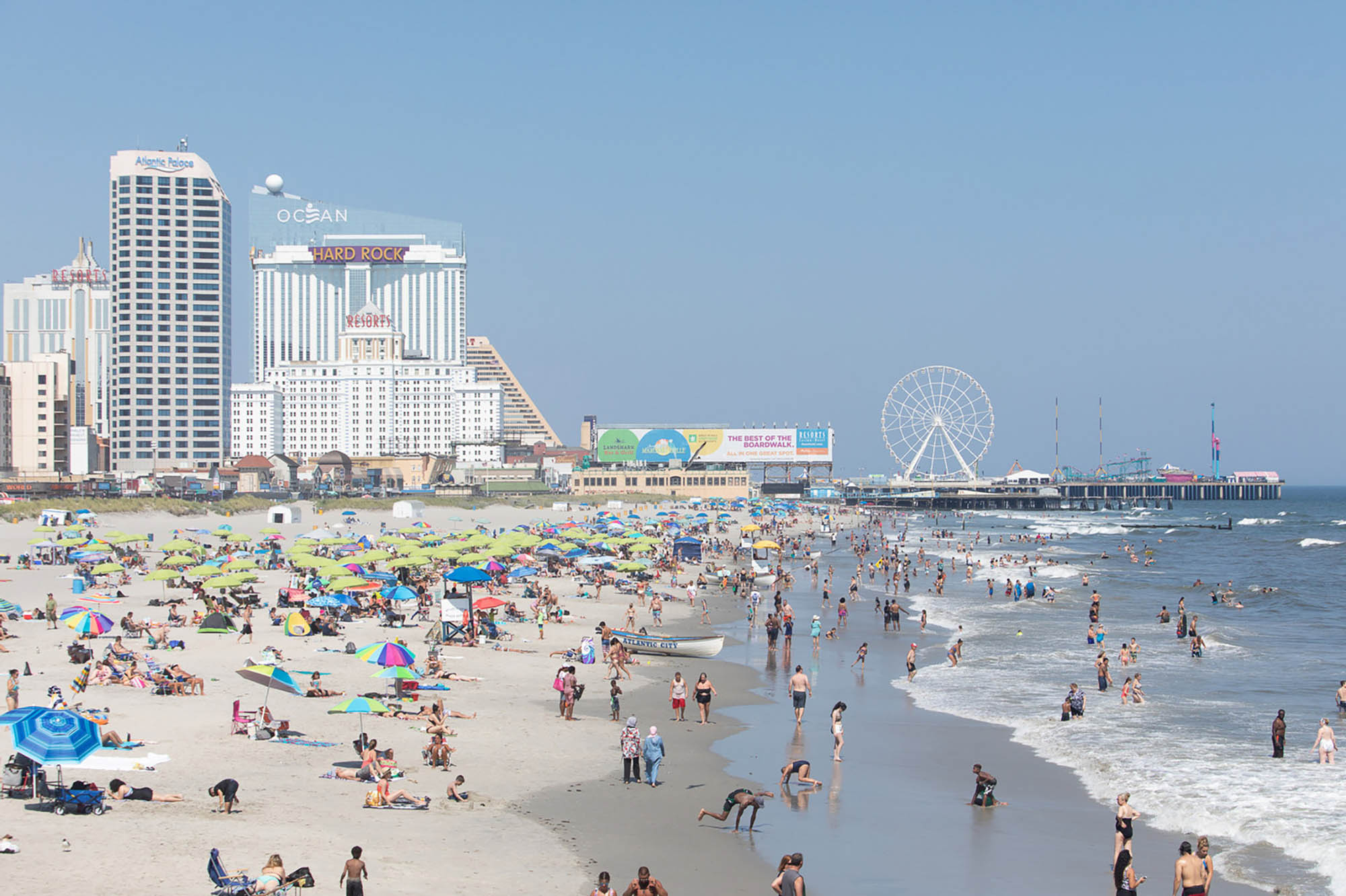 Beachgoers lounging on the shore in Atlantic City, New Jersey
