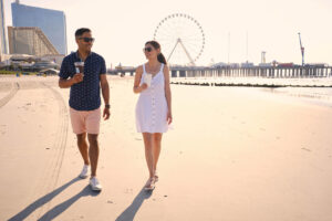 A couple walking along the beach in Atlantic City, New Jersey; Credit: Visit Atlantic City