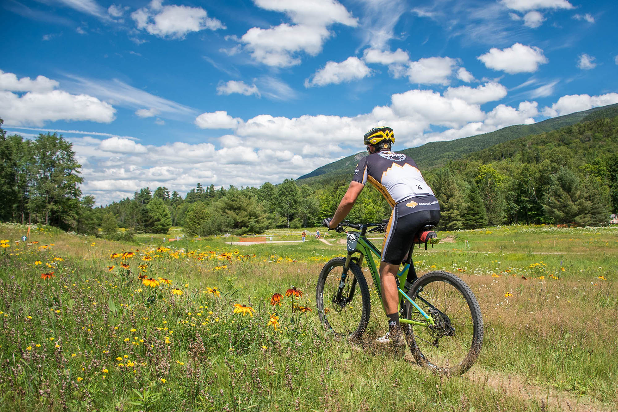 Mountain biker racing through the Great Glen Trails in New Hampshire’s White Mountains