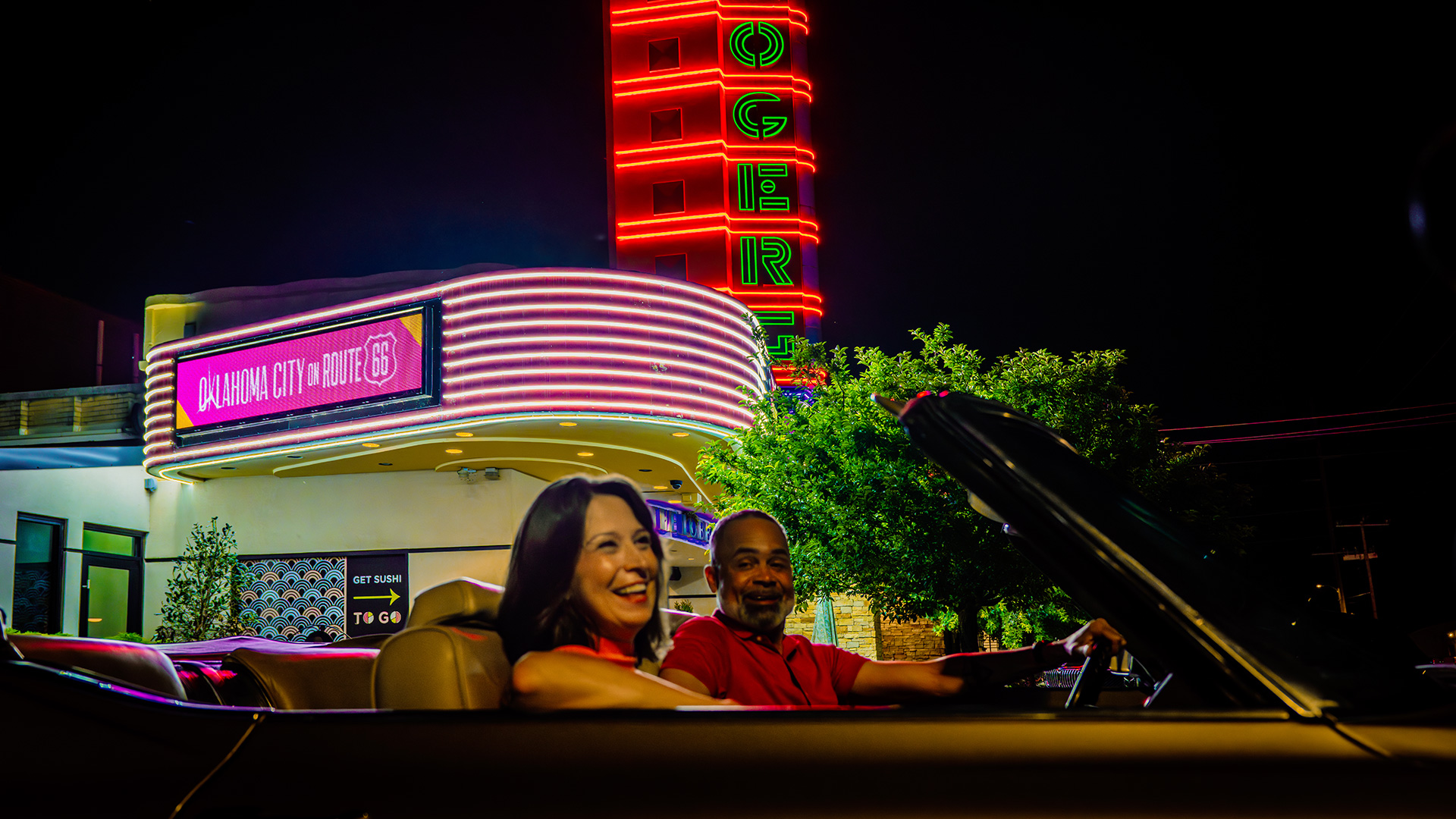 The illuminated Will Rogers Theatre sign in the Western Avenue District of Oklahoma City, Oklahoma