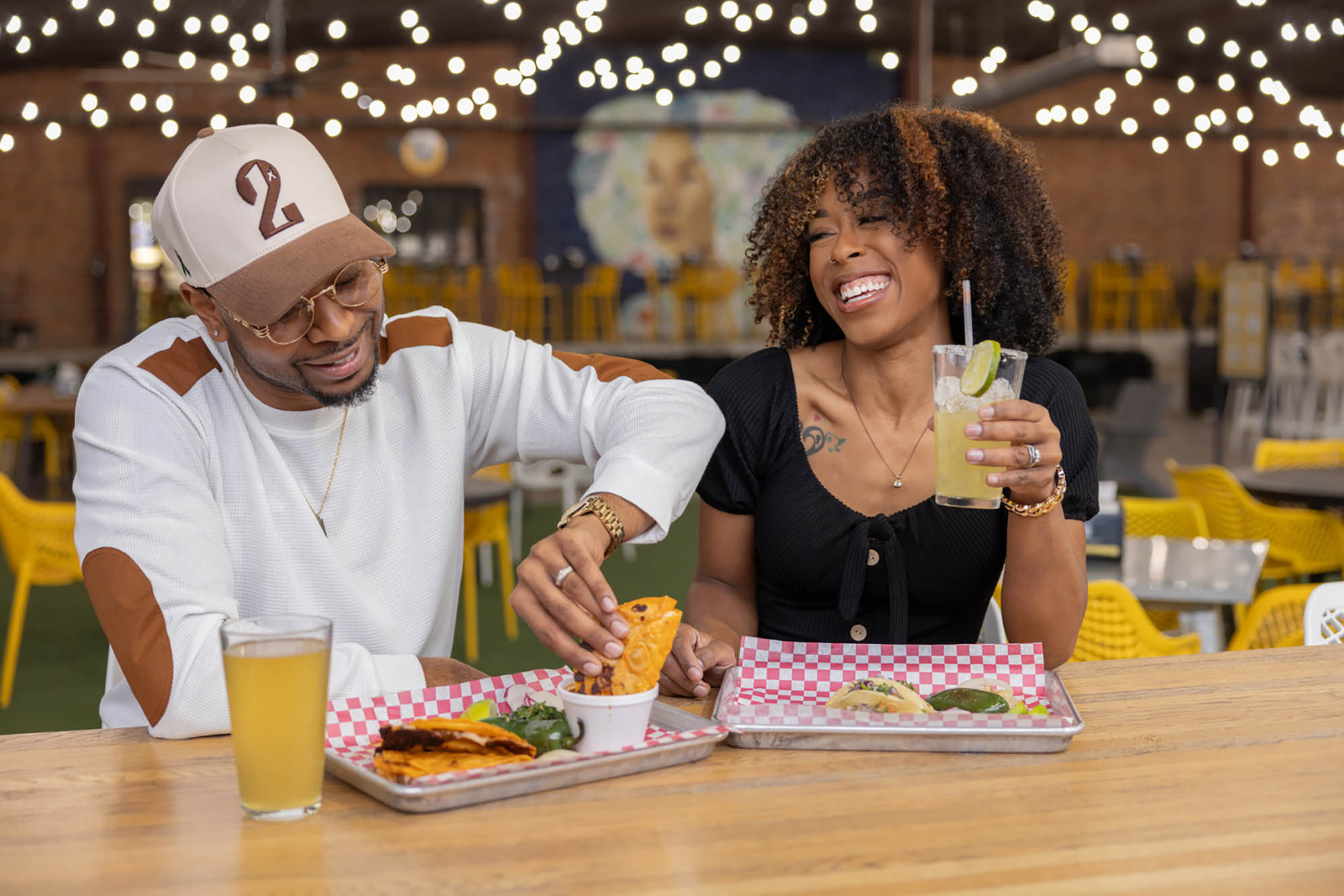 A couple eating dinner at the Mother Road Market in Tulsa, Oklahoma;  Credit: Valerie Wei-Haas
