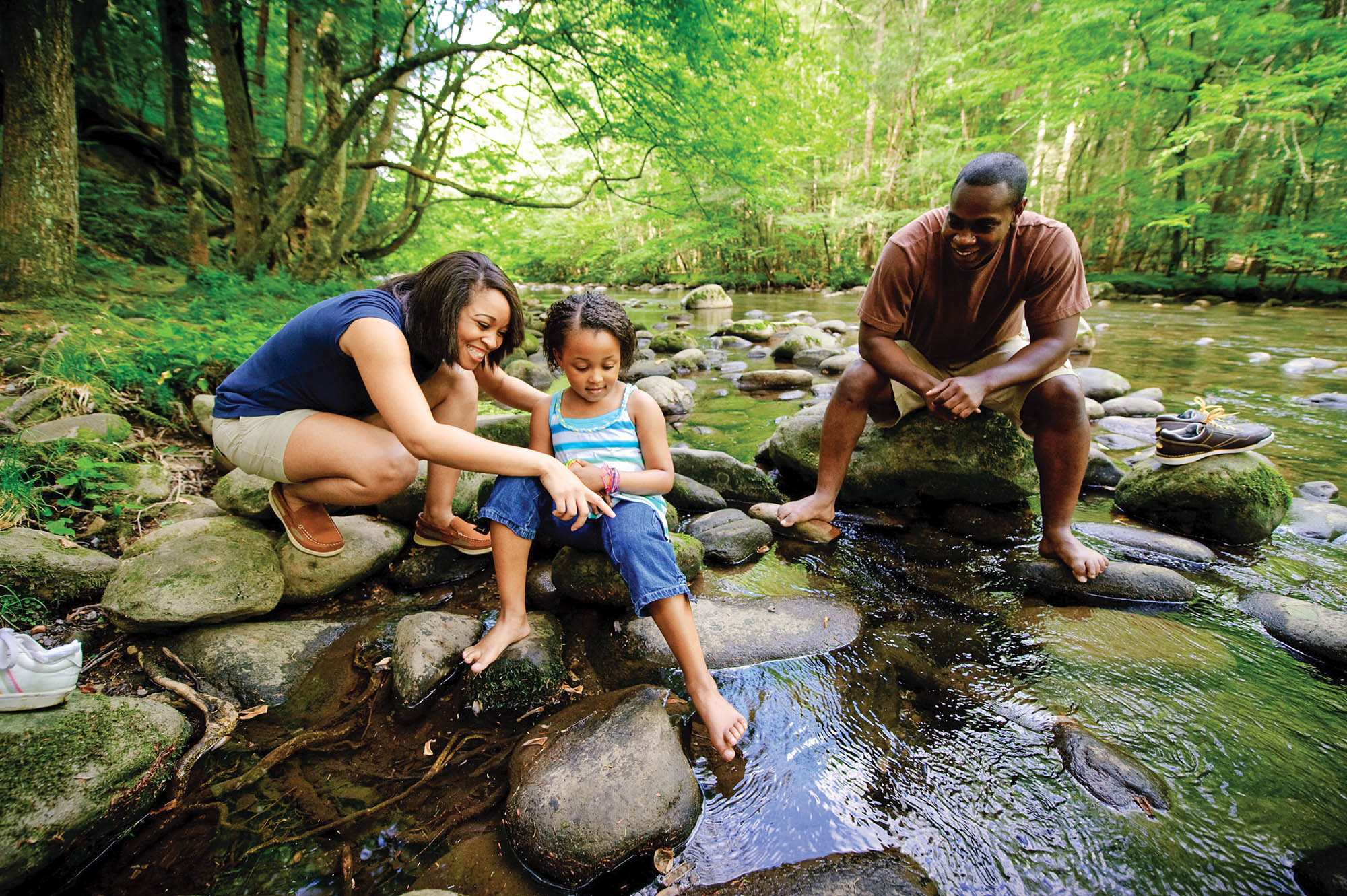 Family playing in a mountain stream near Gatlinburg, Tennessee; Credit: Tennessee Department of Tourism Development