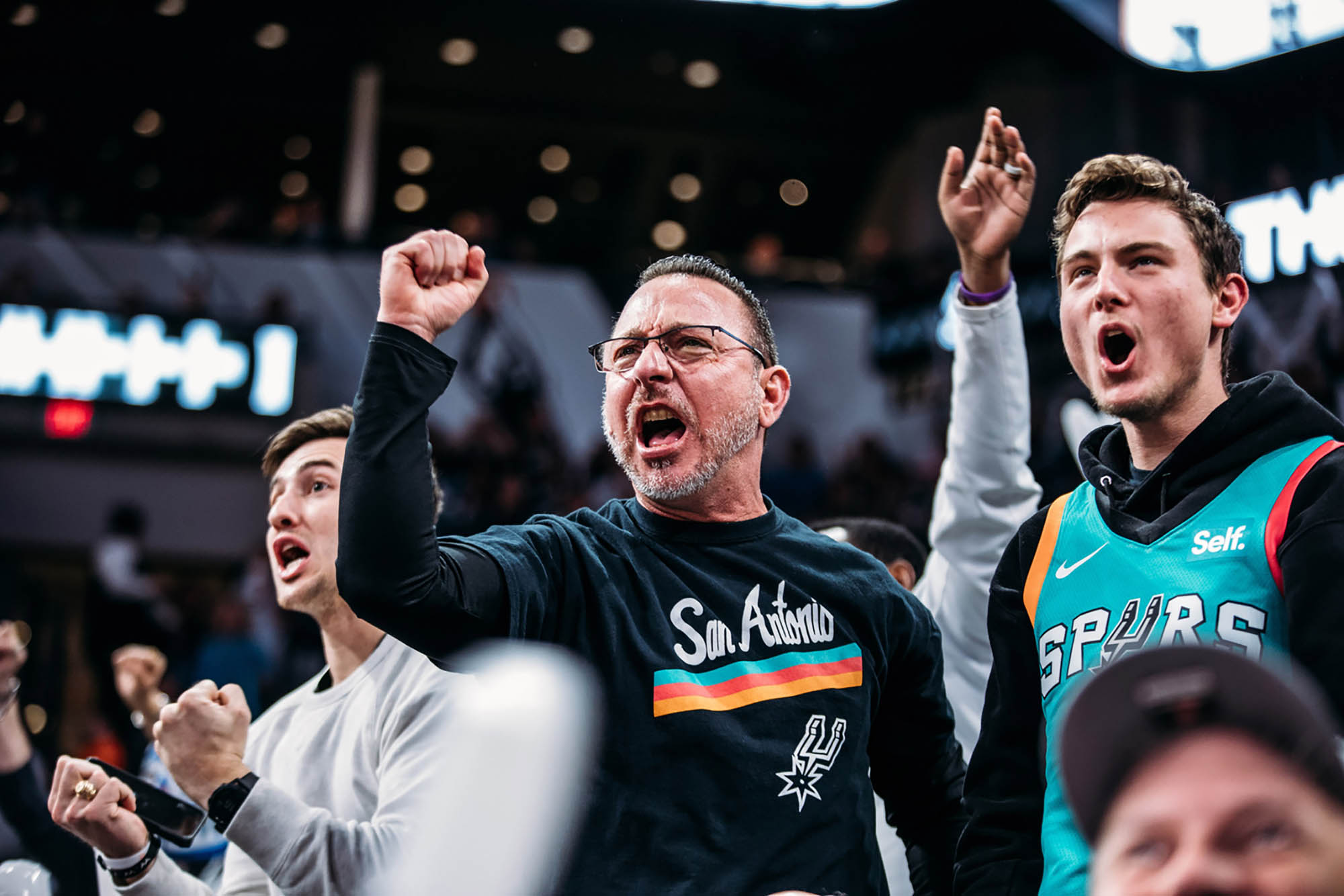 Passionate sports fans at a San Antonio Spurs basketball game in San Antonio, Texas

