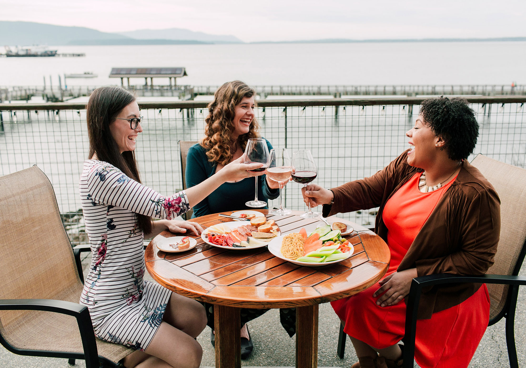 Friends enjoying a meal at Chrysalis Inn & Spa in Bellingham, Washington.