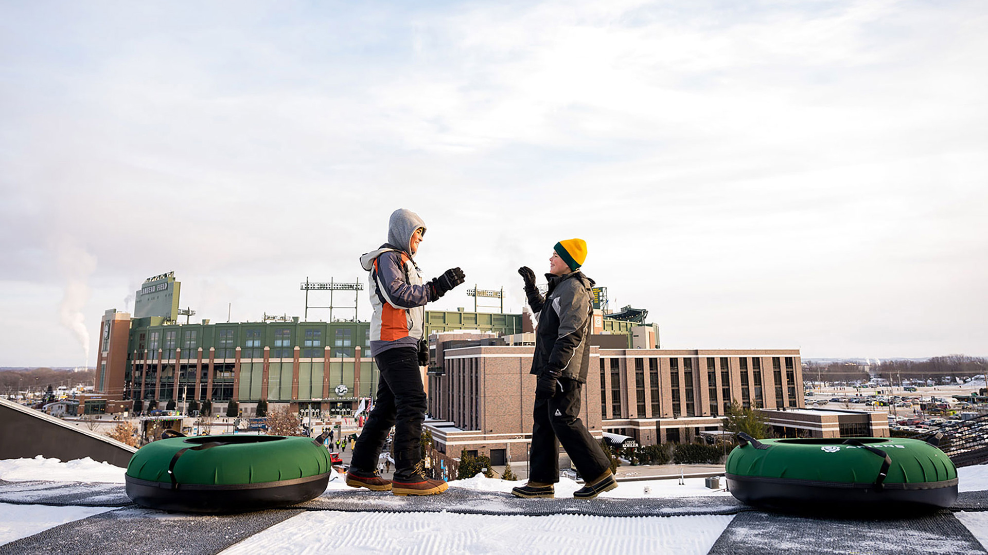 Visitors snow tubing at Titletown near Lambeau Field in Green Bay, Wisconsin
