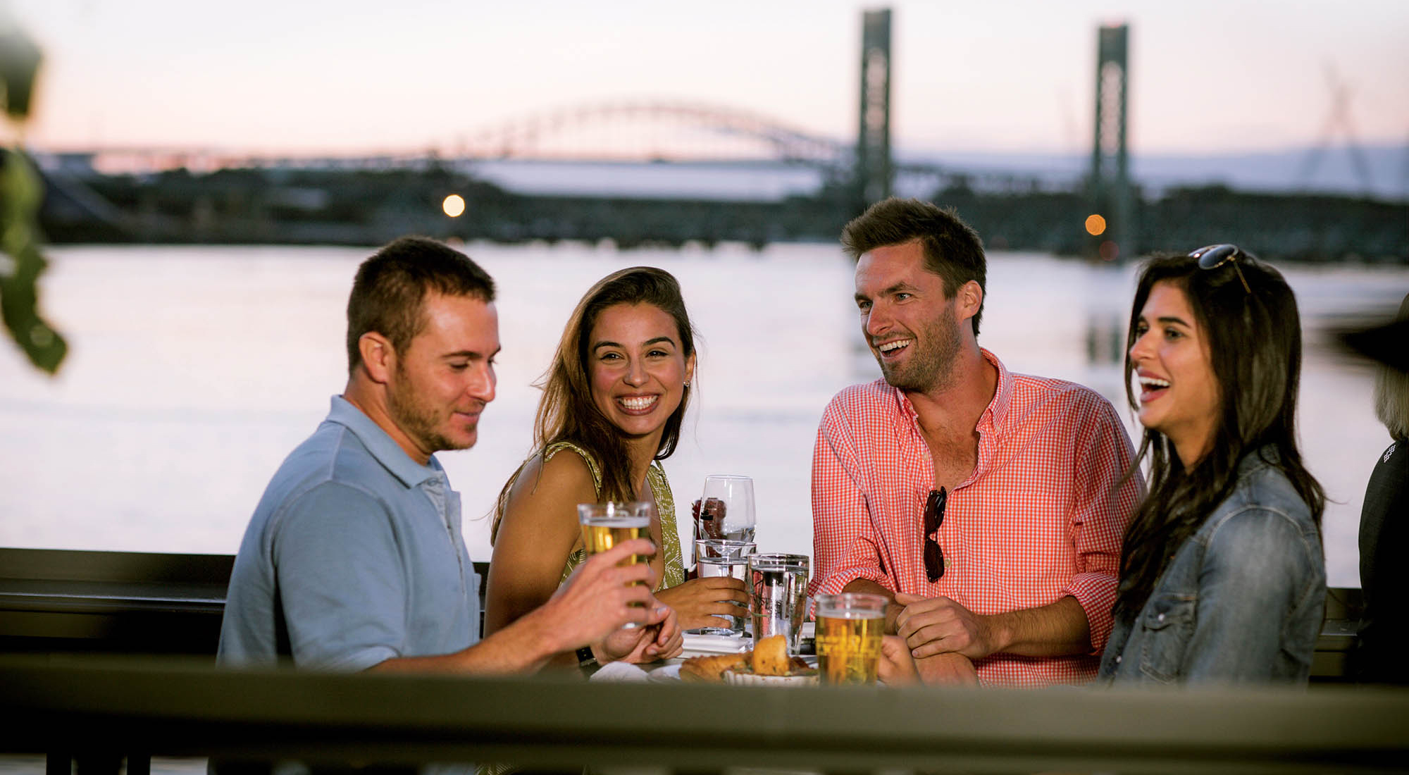 A group enjoys waterfront patio dining in Portsmouth, New Hampshire