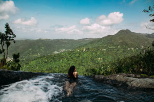 Relaxing in the Infinity Pool in El Yunque National Forest in Río Grande, Puerto Rico; Credit: Discover Puerto Rico