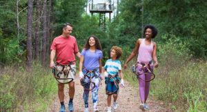 Prepping for a zip line ride at Orlando TreeTrek near Kissimmee, Florida