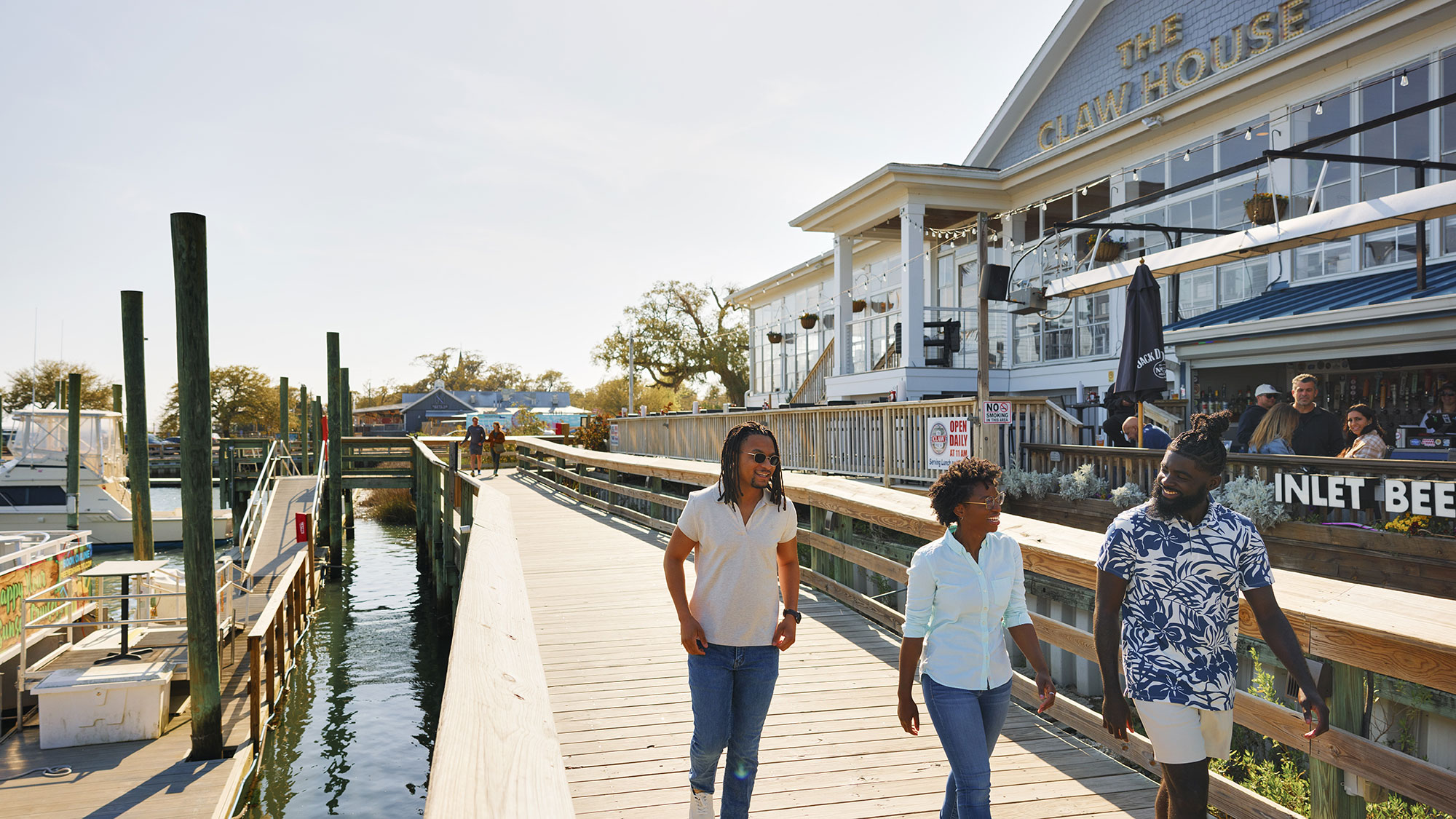 Family walking along the Murrells Inlet Marsh Walk near Myrtle Beach, South Carolina