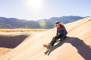Sandboarding in Great Sand Dunes National Park and Preserve near Alamosa, Colorado