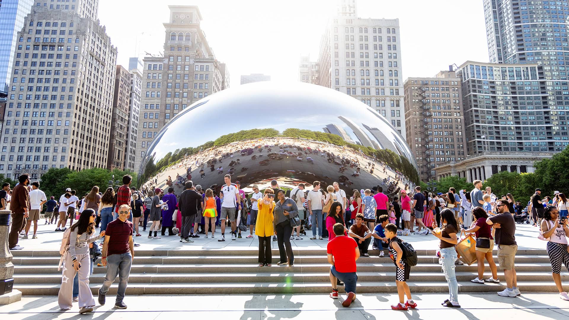 Posing by The Bean sculpture in Chicago, Illinois; Credit: Kathleen Hinkel
