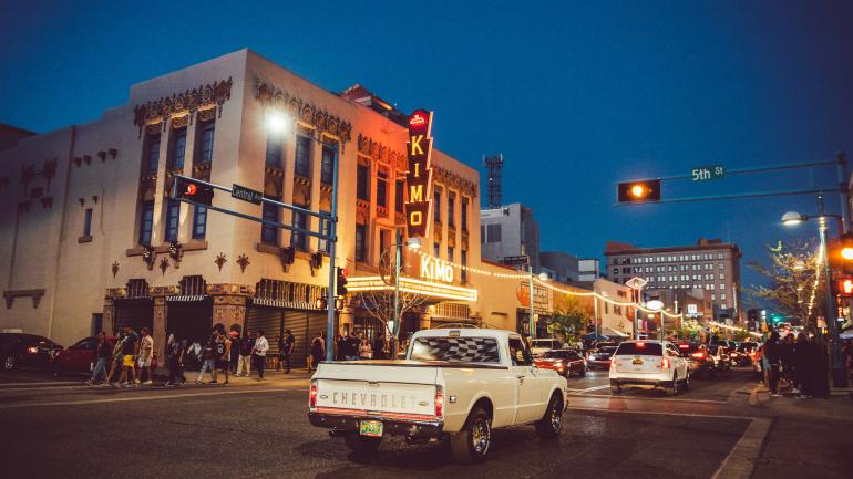 Cruising toward the KiMo Theatre in bustling downtown Albuquerque; Credit: New Mexico True