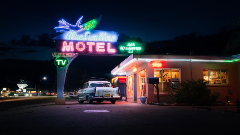Evening view of the iconic neon sign outside Blue Swallow Motel in Tucumcari; Credit: New Mexico True