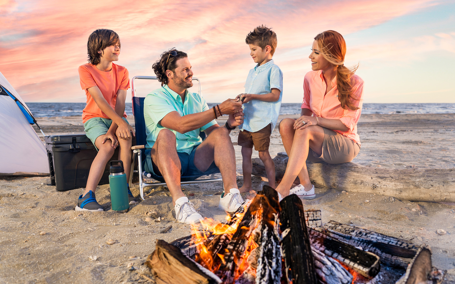 Family enjoying a bonfire at Sea Rim State Park in Port Arthur, Texas