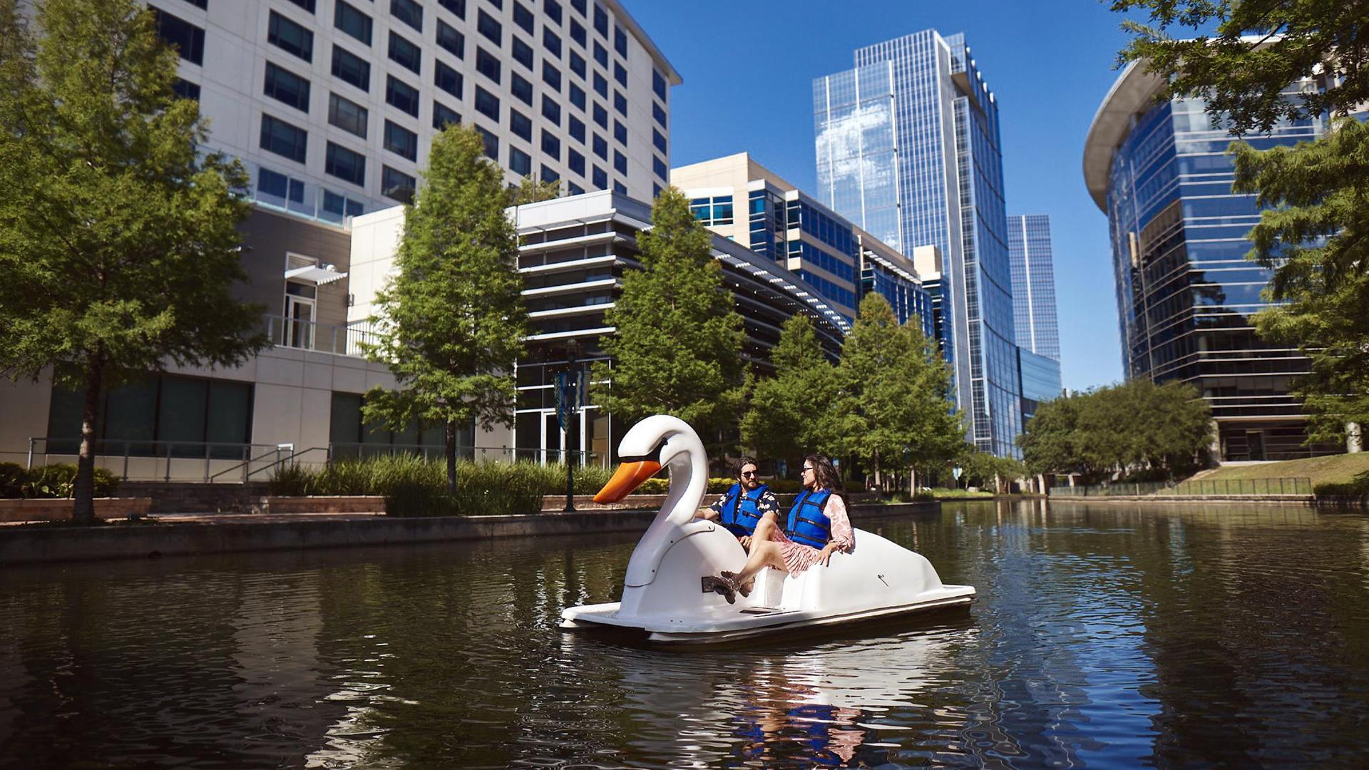Swan boats on the Woodlands Waterway in Texas
