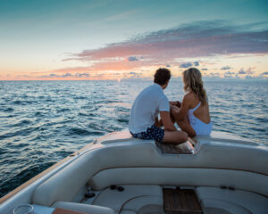 Couple watching the sunset from a boat off Naples, Florida