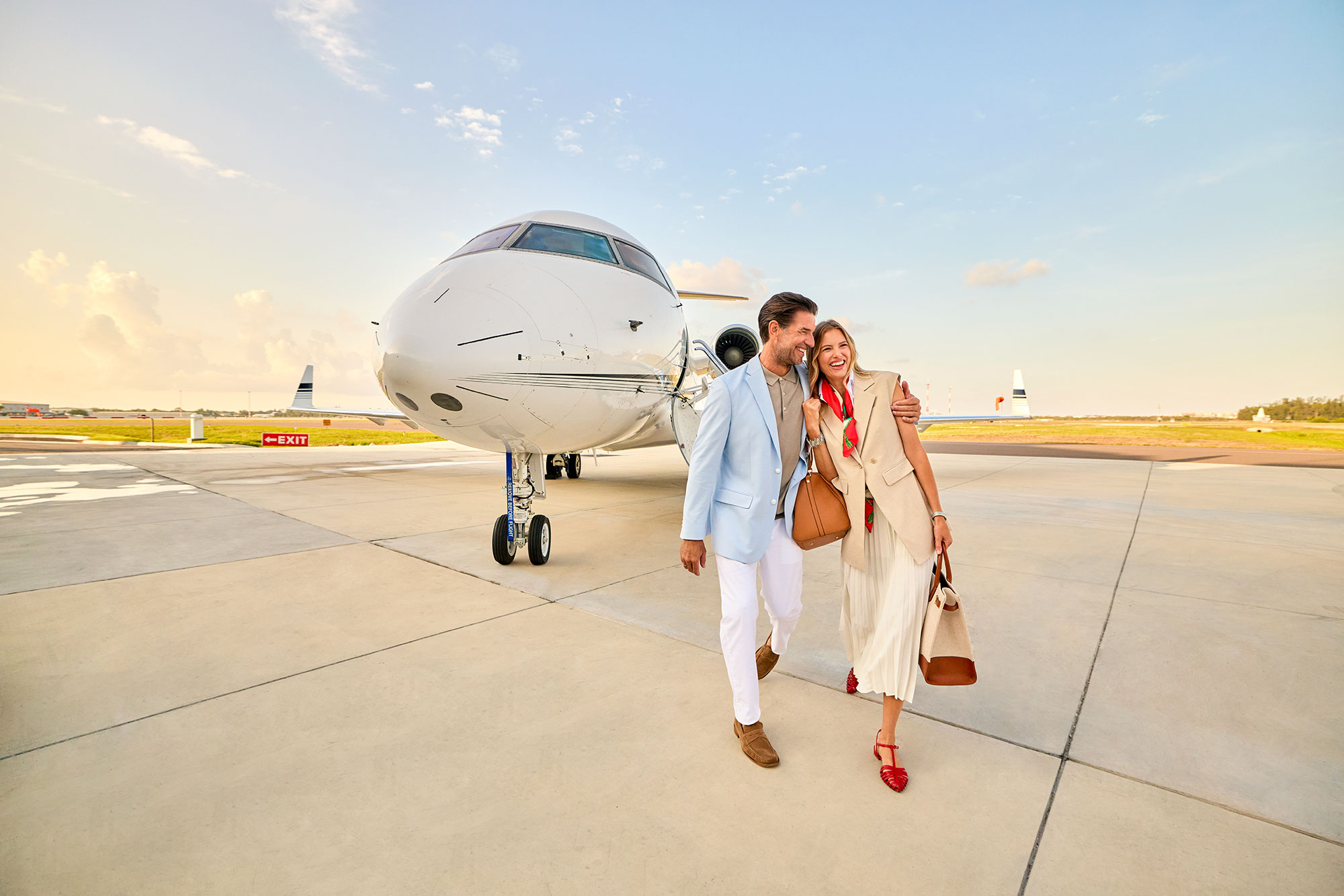 Couple arriving by private jet to Naples, Florida