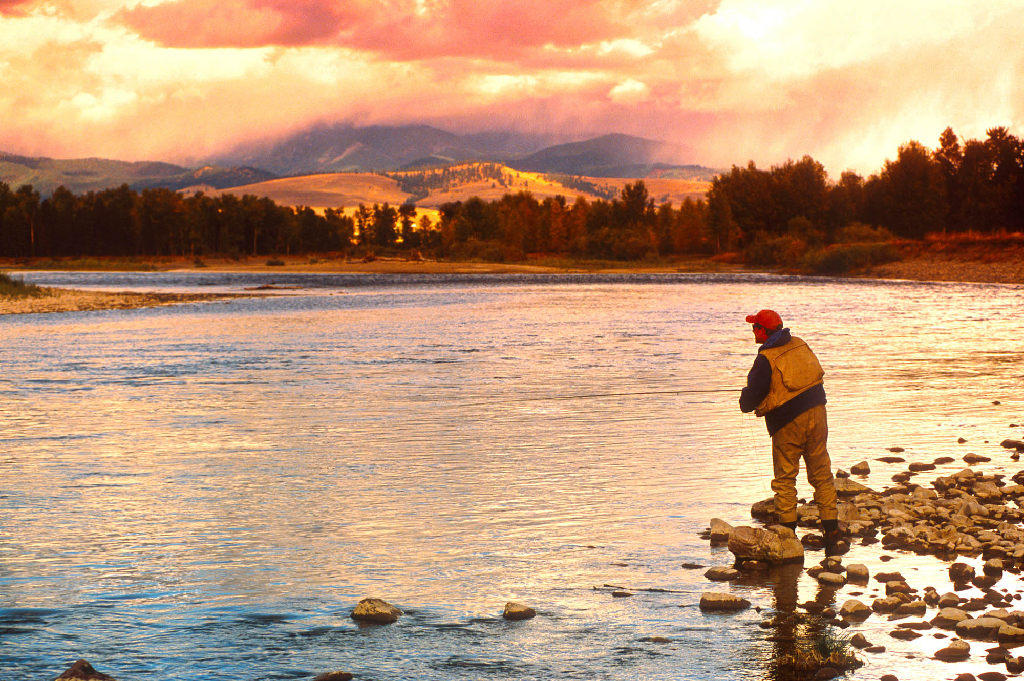 Sunset fishing on the Blackfoot River in Glacier Country, Montana
