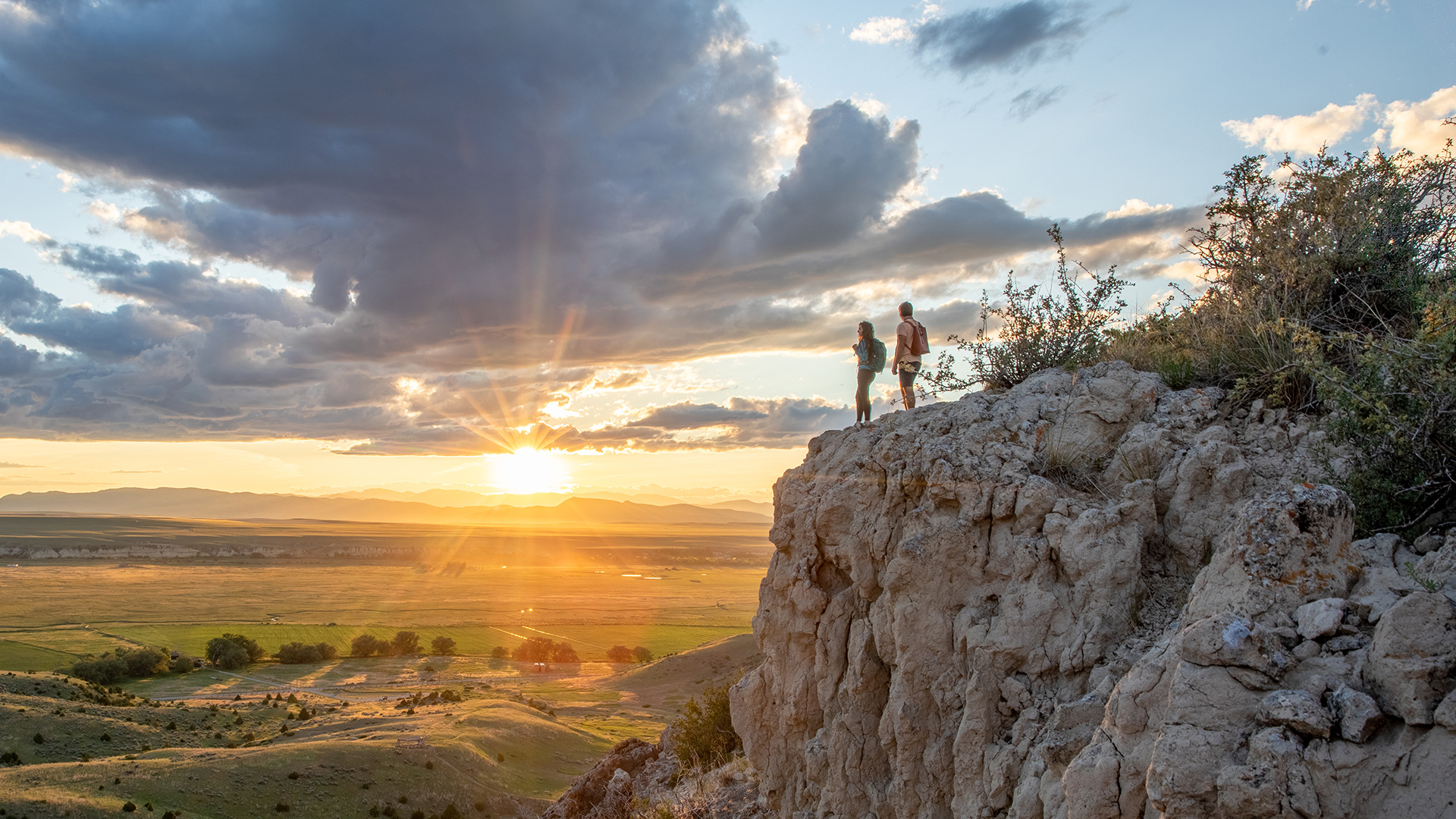 Hikers at Madison Buffalo Jump State Park in Montana; Credit: Andy Austin