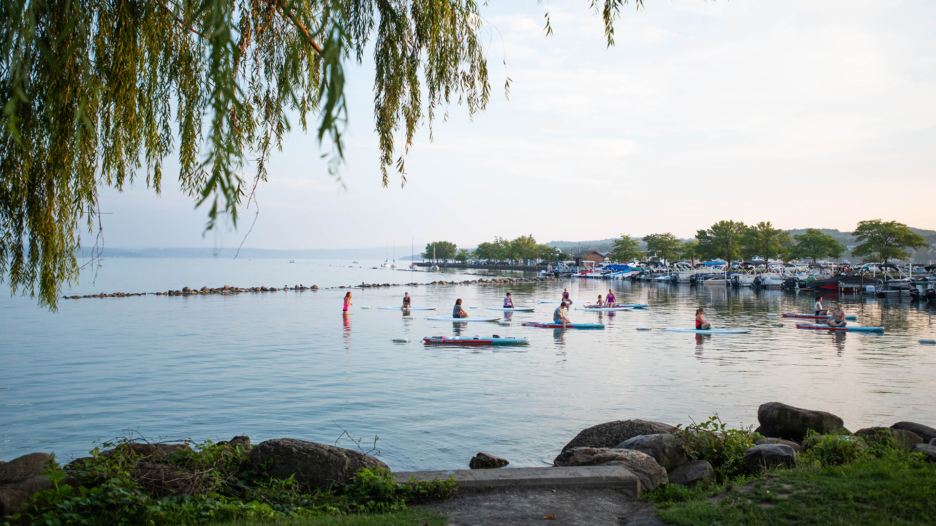 Paddleboard yoga on Canandaigua Lake in the Finger Lakes, New York