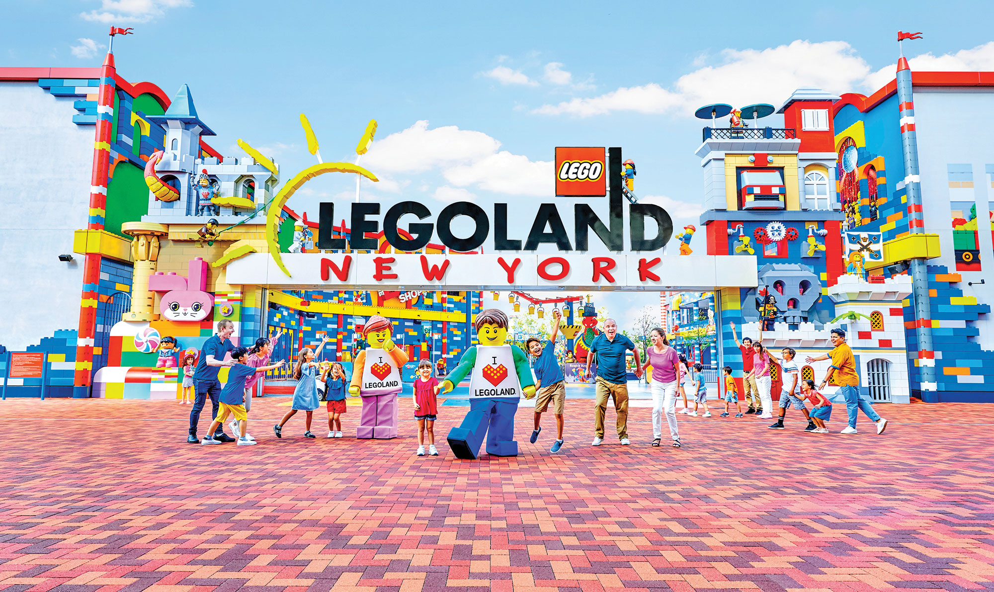 Visitors and mascots at the entrance of LEGOland New York Resort in Goshen, New York
