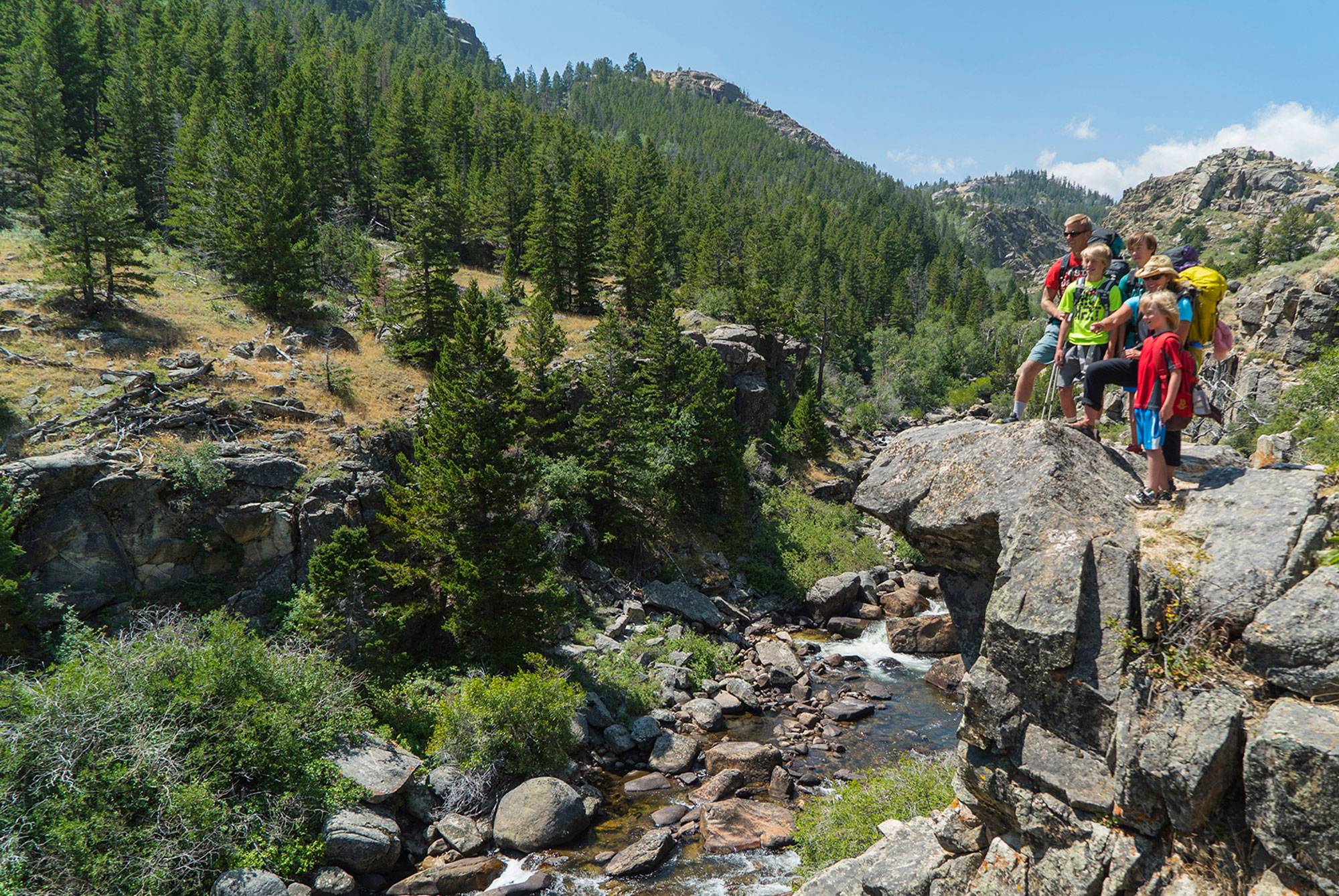 Hikers on the Popo Agie Falls Trail near Lander, Wyoming; Credit: Kyle Duba
