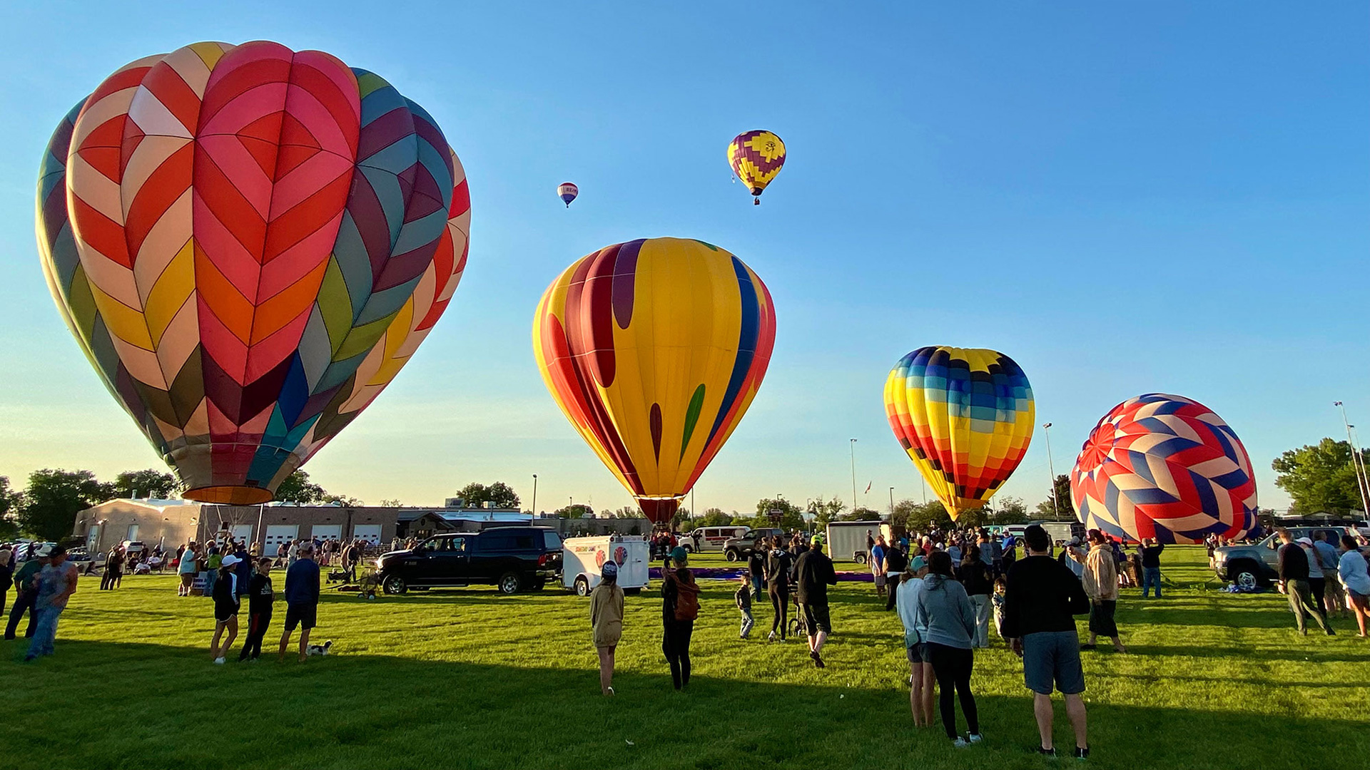 Hot-air balloons and attendees at the Riverton Rendezvous Balloon Rally in Riverton, Wyoming; Credit: Melanie Hoefle/Wind River Country