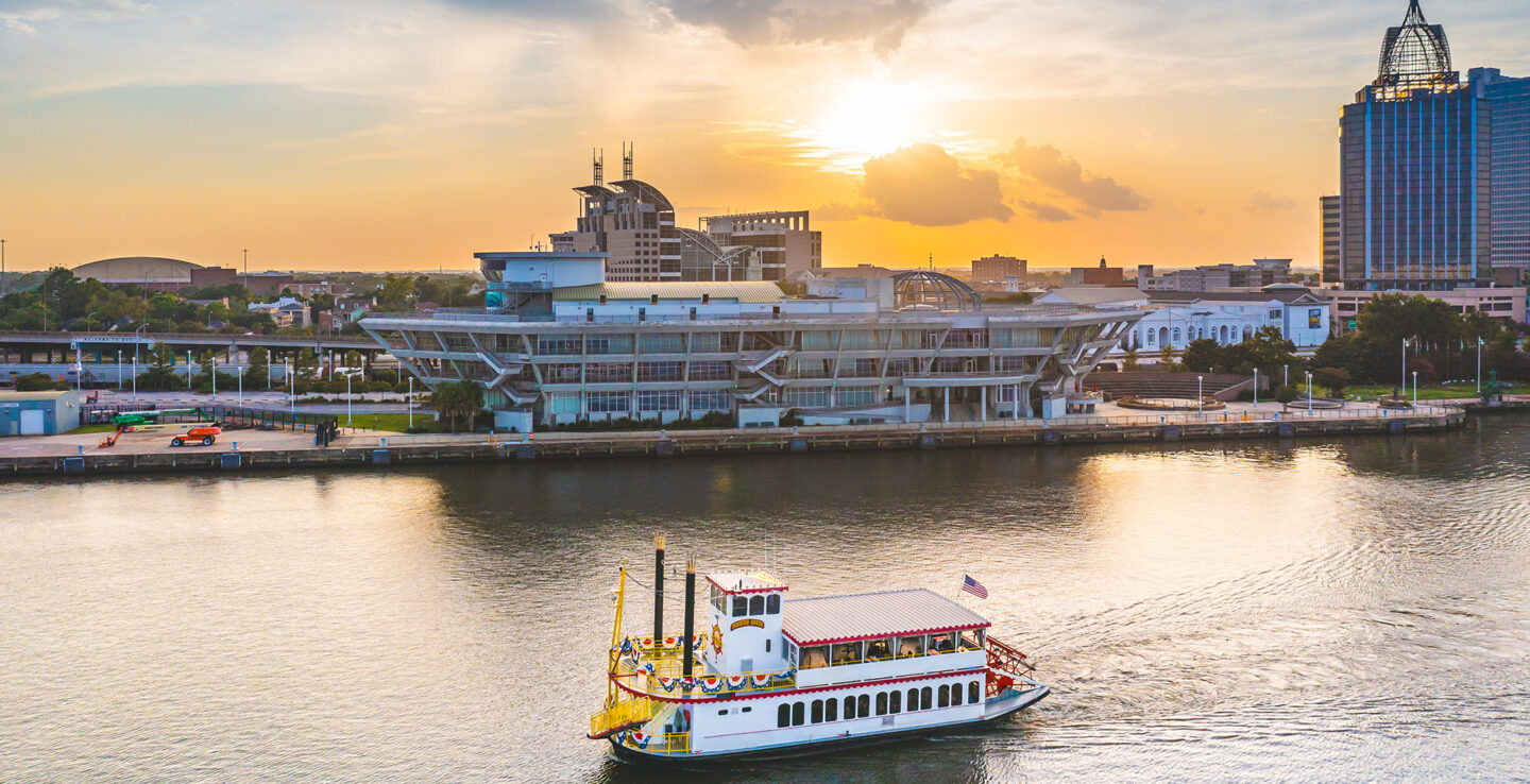 A tour boat cruises through Mobile Bay in Mobile, Alabama