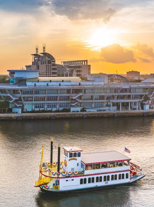 A tour boat cruises through Mobile Bay in Mobile, Alabama