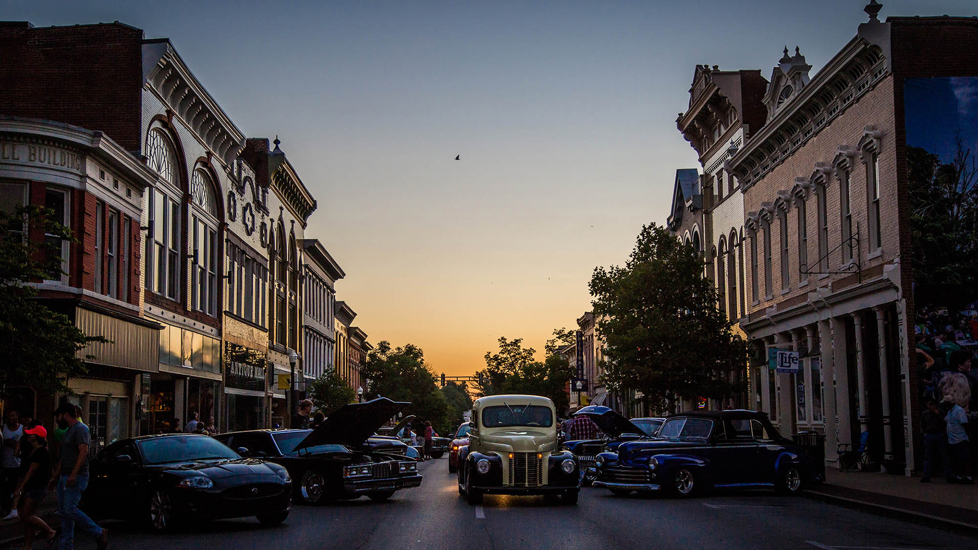 Vintage cars on Main Street during sunset in Shelbyville, Kentucky