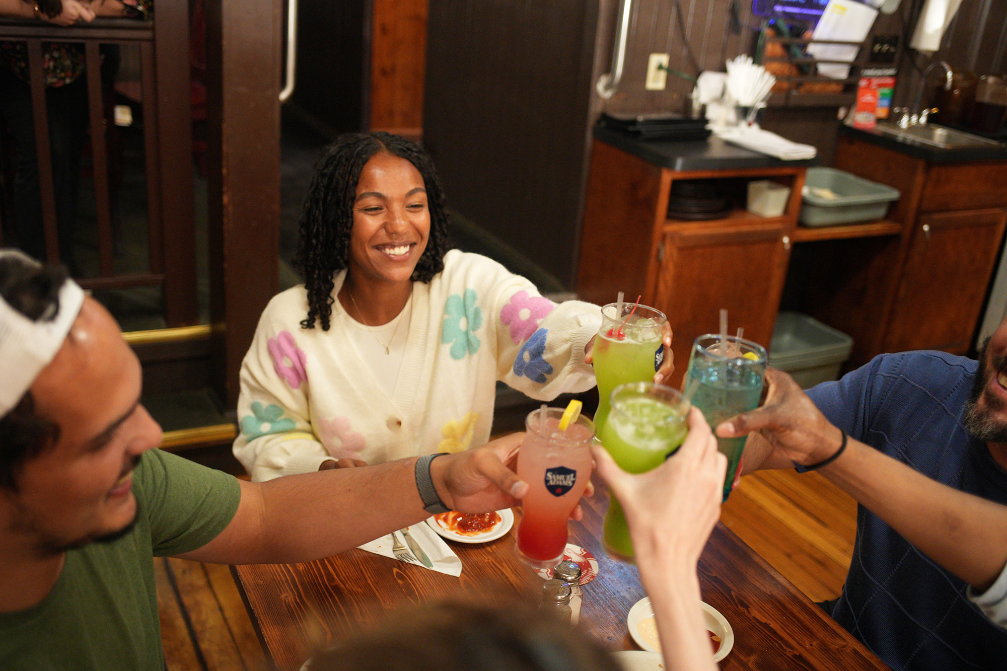 Friends having cocktails at The Anvil Saloon in Ste. Geneviève, Missouri
