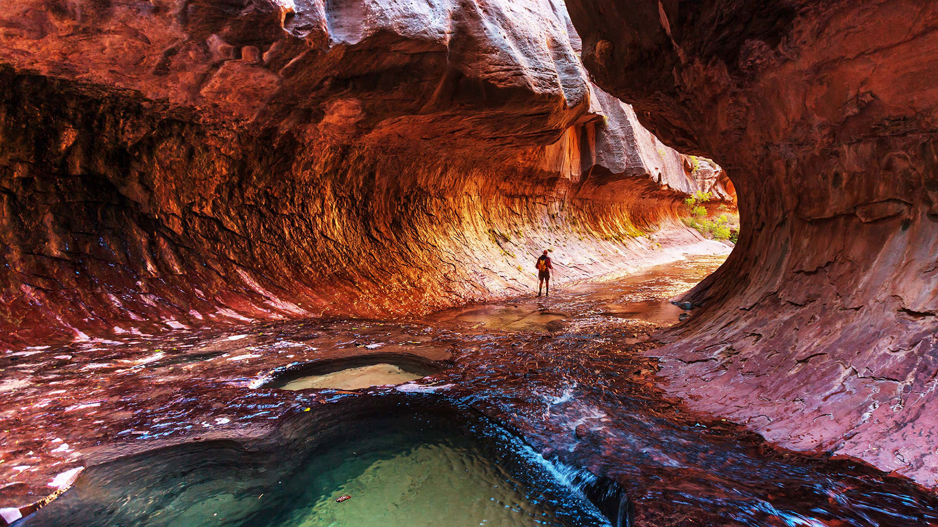 Hiker on the Emerald Pools Trail in The Subway at Zion National Park in Utah