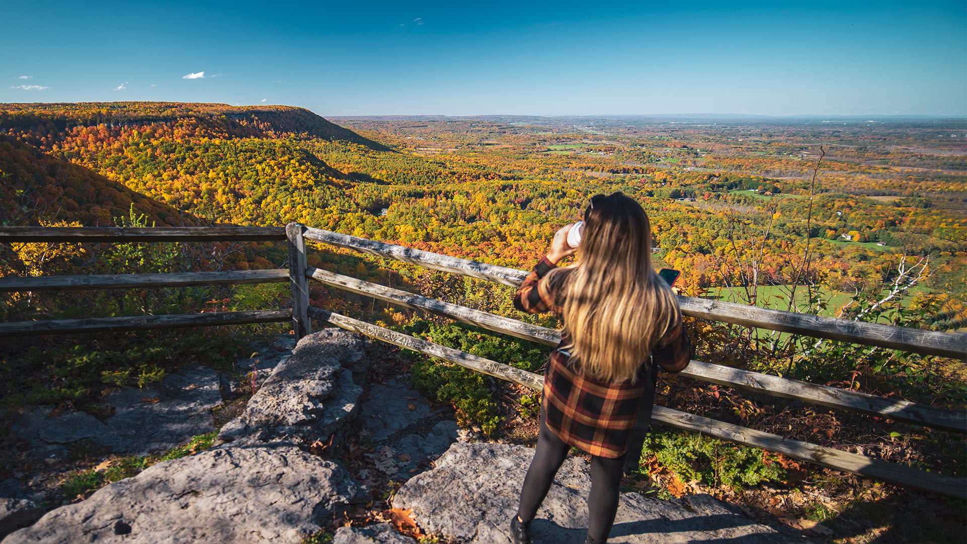 Enjoying a scenic overlook in John Boyd Thacher State Park, part of New York’s Capital Saratoga Region, in the fall; Credit: Relentless Awareness
