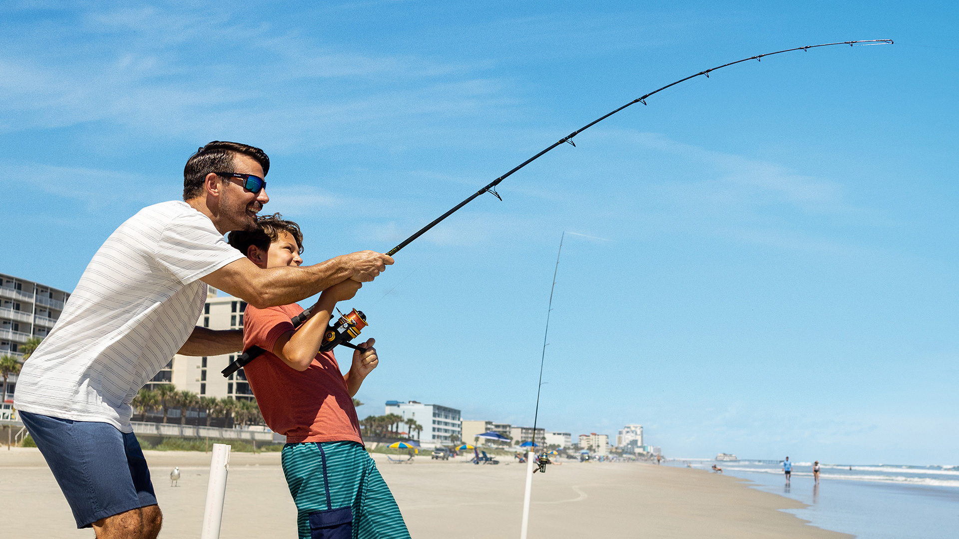 Father and son fishing in Daytona Beach, Florida