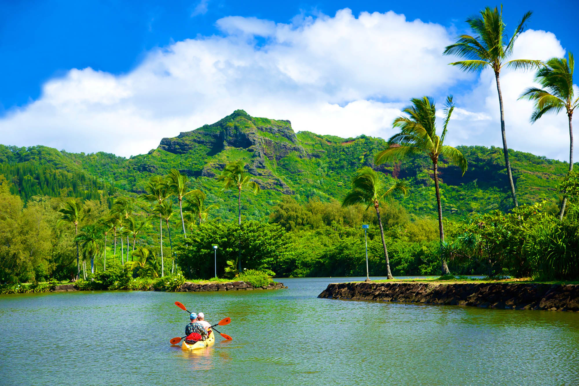 Kayaking on the Wailua River in Kauaʻi, Hawaiʻi; Credit: Kicka Witte