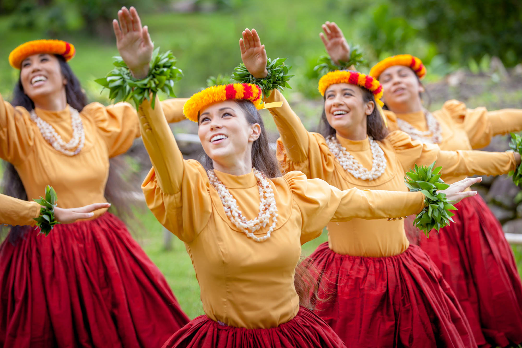 Graceful dancers performing hula on Oʻahu, Hawaiʻi; Credit: Nicholas Tomasello, HTA