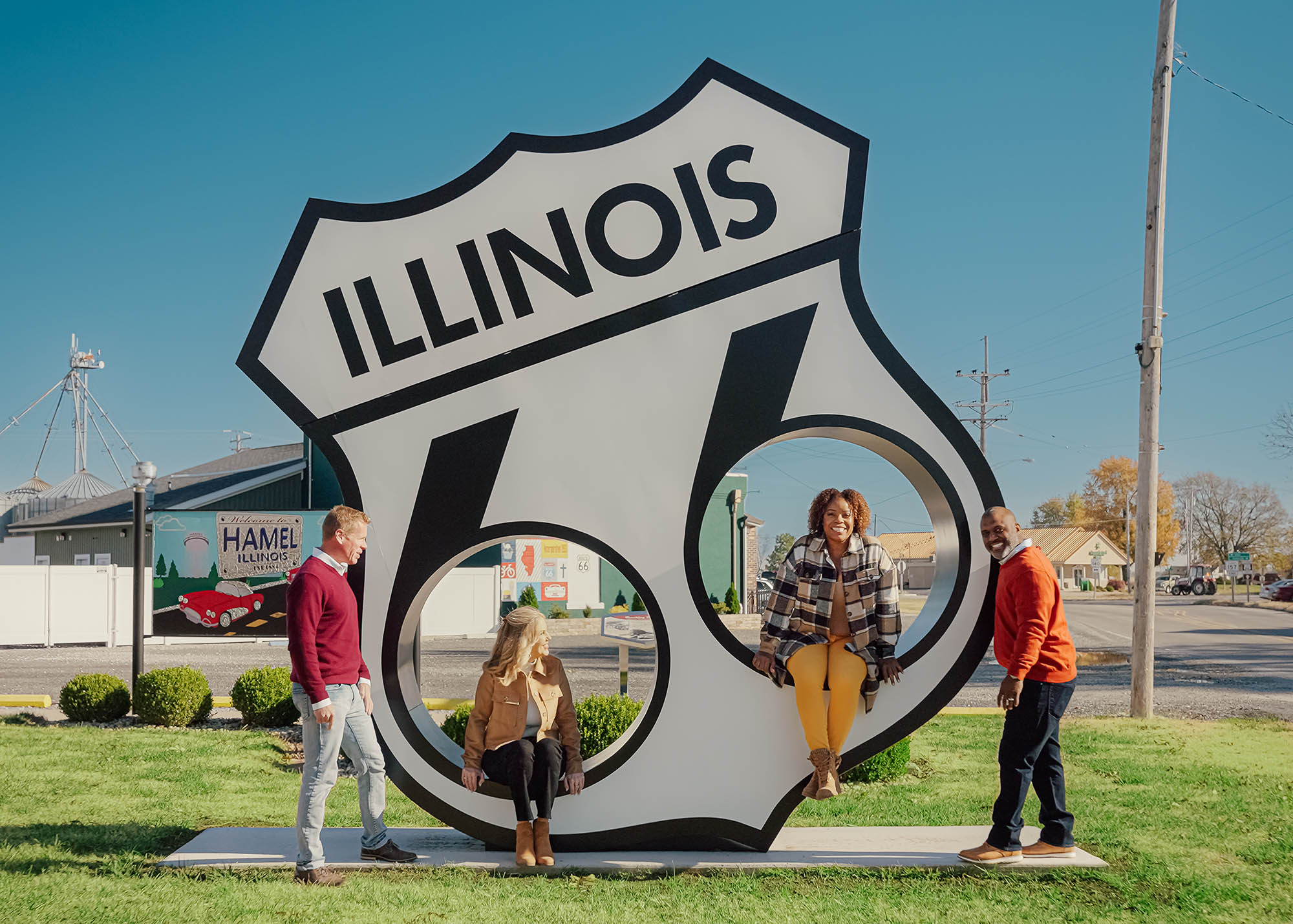 Posing with a Route 66 sign in Hamel, Illinois
