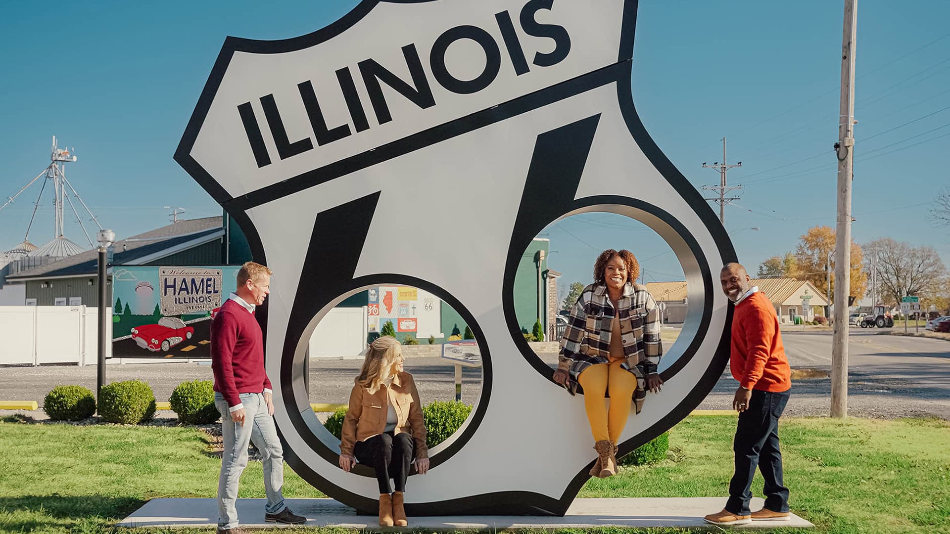 Posing with a Route 66 sign in Hamel, Illinois