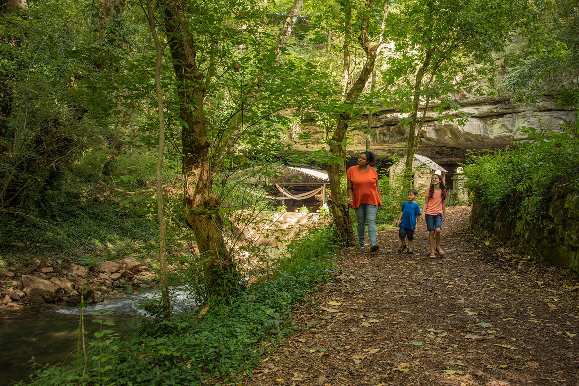 A family hiking a nature trail at Lost River Cave in Bowling Green, Kentucky