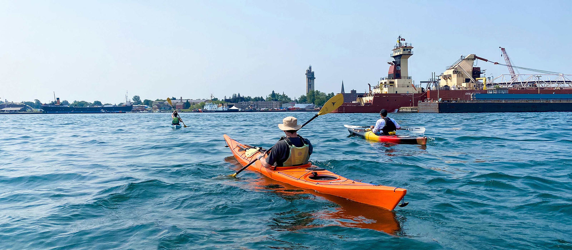 Kayakers on the St. Marys River by the Soo Locks in Sault Ste. Marie, Michigan